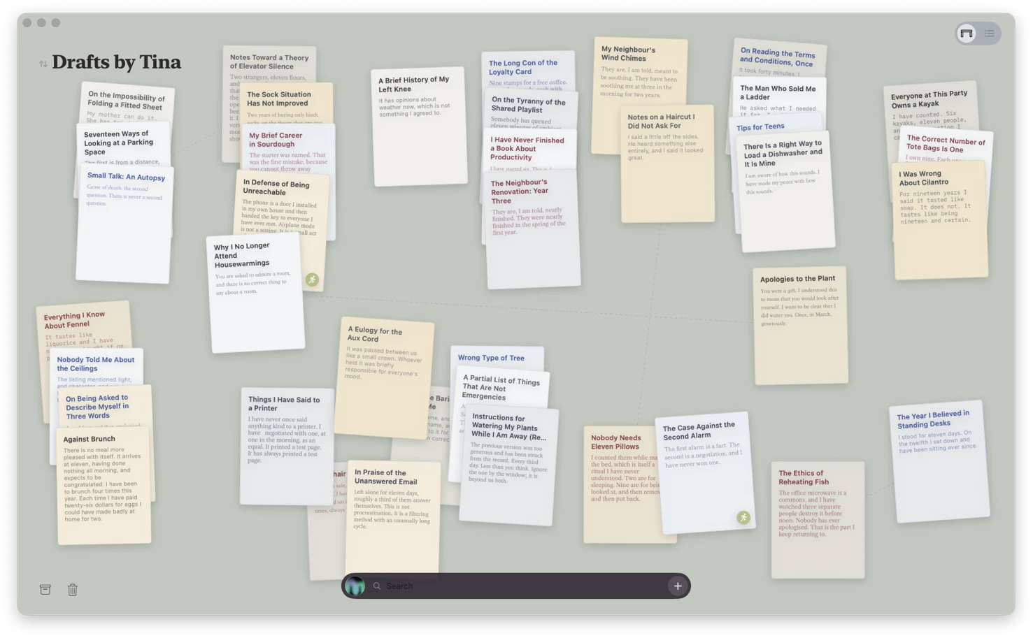 The desk: a few dozen drafts lying scattered and crooked across a grey-green surface.